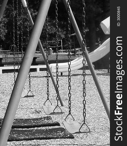 Swings in a park in black and white close up. Swings in a park in black and white close up