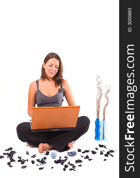 Beautiful young woman on yoga position with orange laptop. Beautiful young woman on yoga position with orange laptop