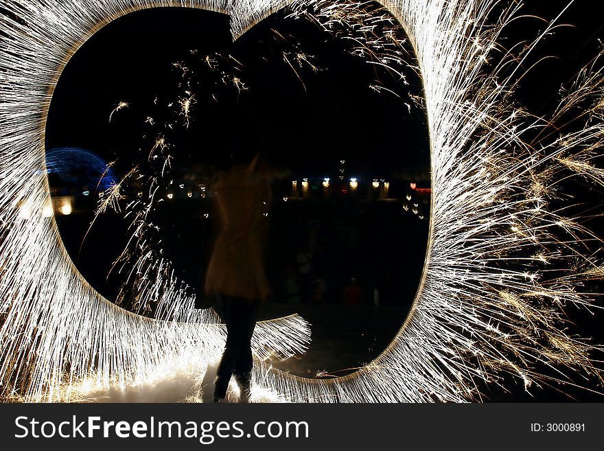 Fire show on night sky background