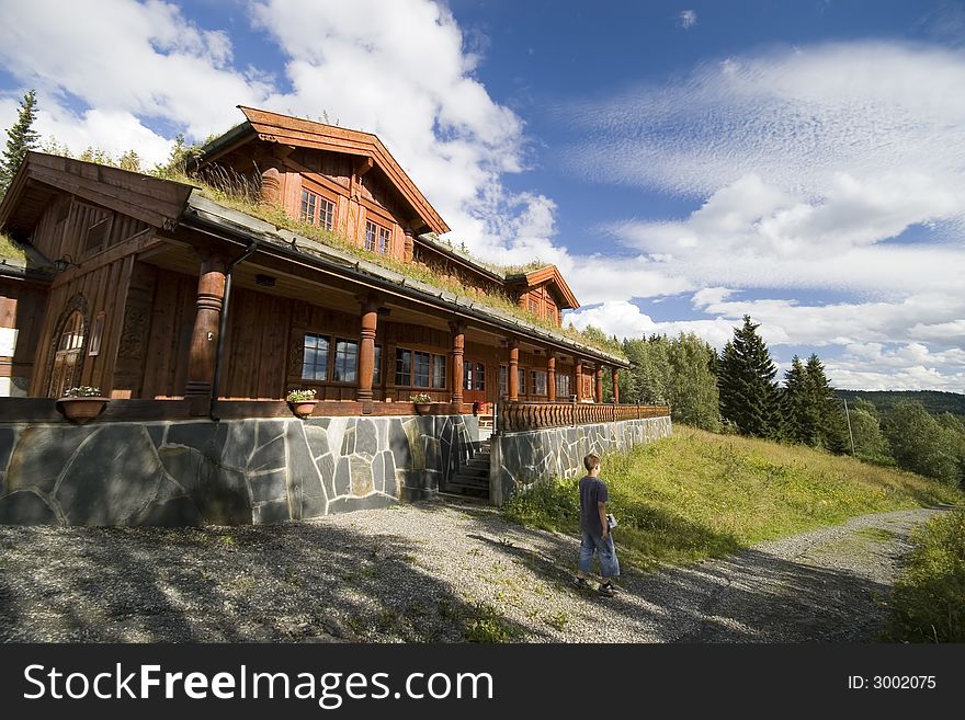 A characteristic Norwegian house, with the roof covered with grass. A boy walking past. BEAUTY OF NORWAY COLLECTION Â». A characteristic Norwegian house, with the roof covered with grass. A boy walking past. BEAUTY OF NORWAY COLLECTION Â»