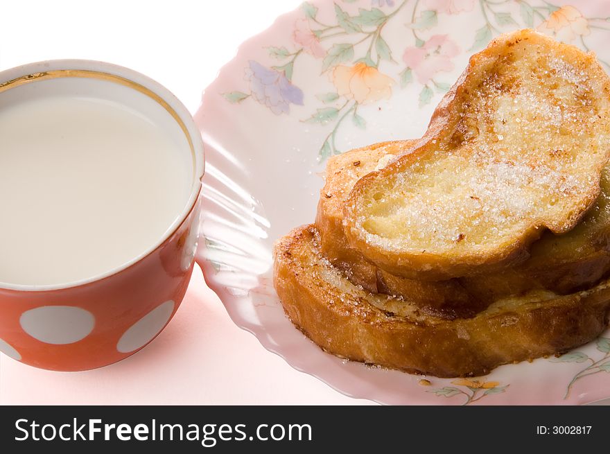 Toast and milk on a china plate