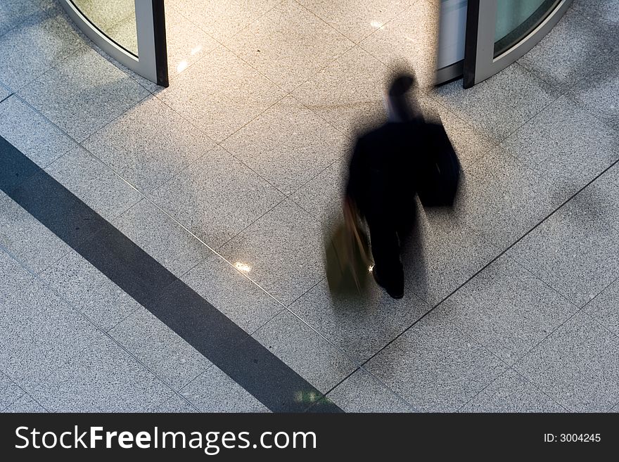 Man rushing through an airport terminal. Man rushing through an airport terminal