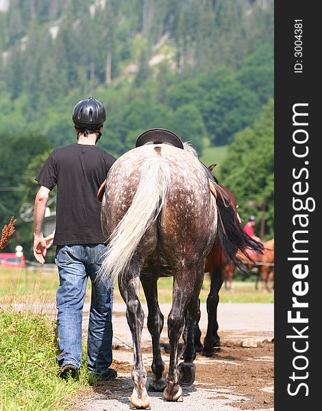 Man walking with its horse. Man walking with its horse