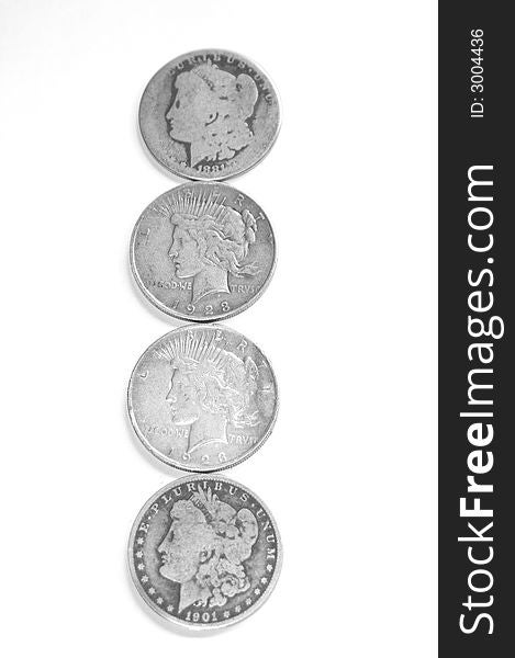 Vintage silver dollars isolated on a white background. Vintage silver dollars isolated on a white background.