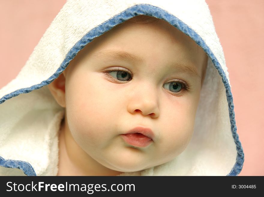 Portrait of a baby with hood
