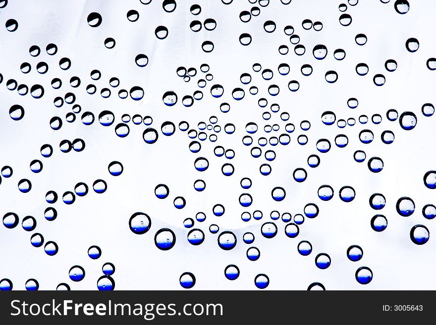 Many blue bubbles in a bottle with white background.