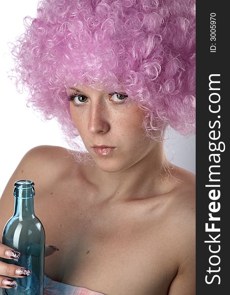 Girl in pink dress and wig with blue bottle