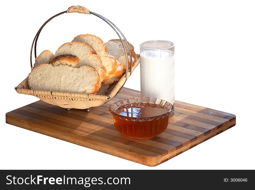 An image of bread in tray and milk in glass. An image of bread in tray and milk in glass