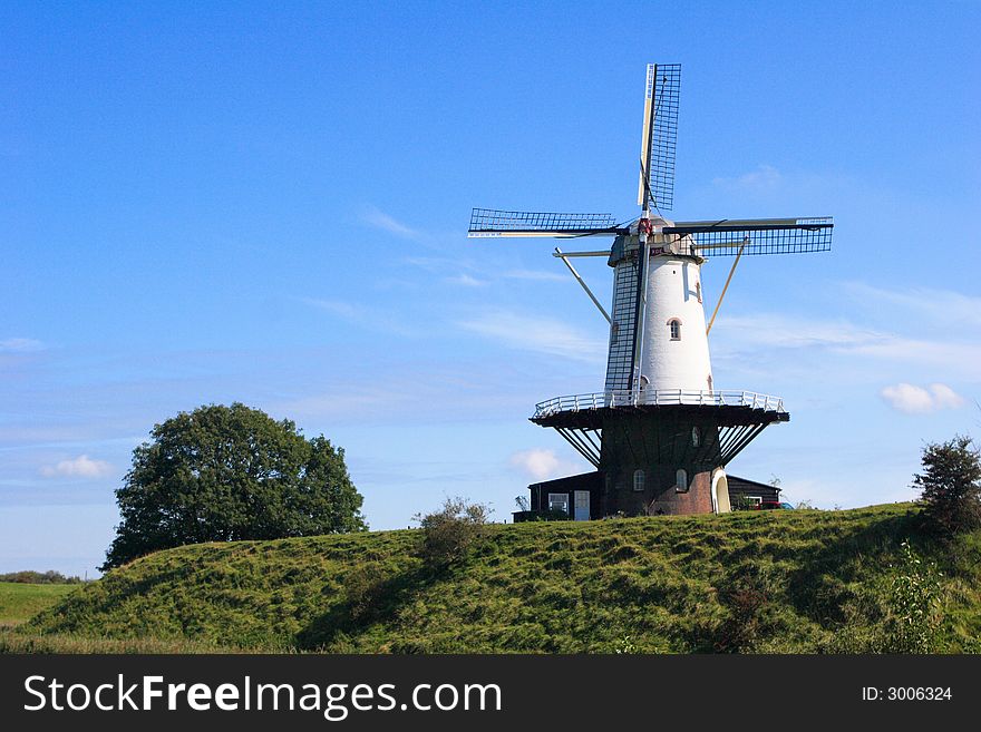 Dutch windmill against a blue sky