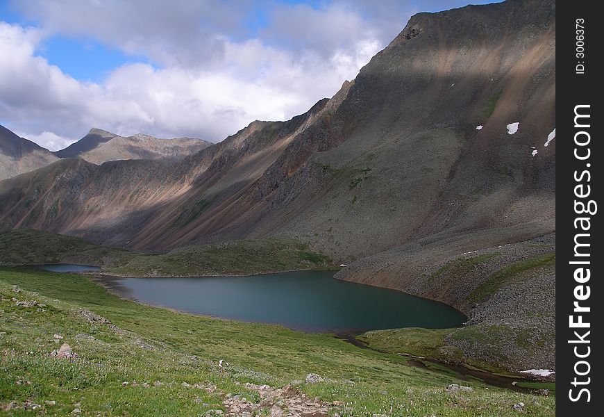 Mountain lake, landscape, high mountains, nature, wilderness, Siberia, Russia. Mountain lake, landscape, high mountains, nature, wilderness, Siberia, Russia