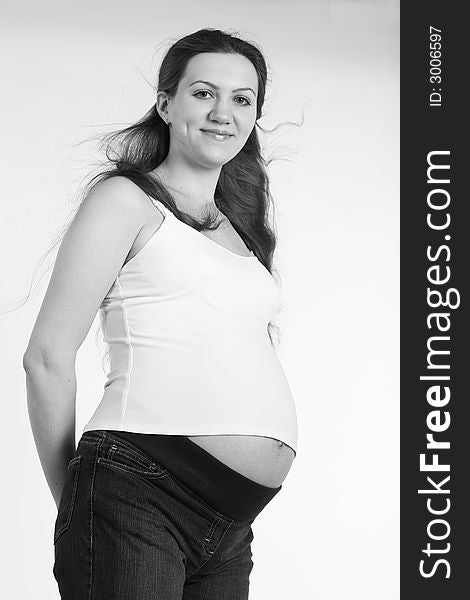 Black and white portrait of smiling pregnant
