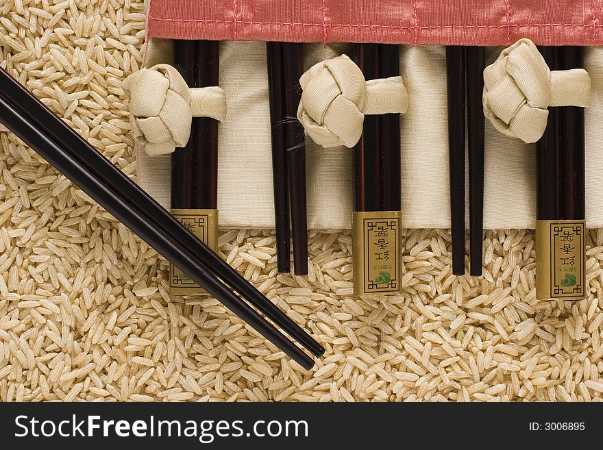 Brown Rice And Chopsticks In S