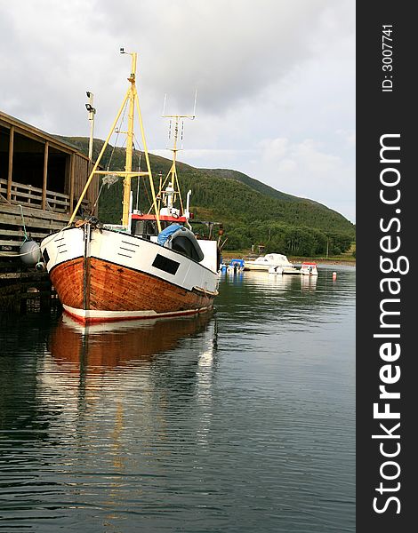 Old wooden shrimp trawler on a dock