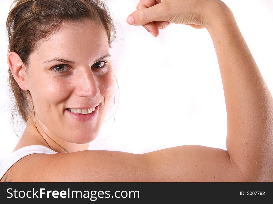 A pretty young woman flexing her biceps. A pretty young woman flexing her biceps.