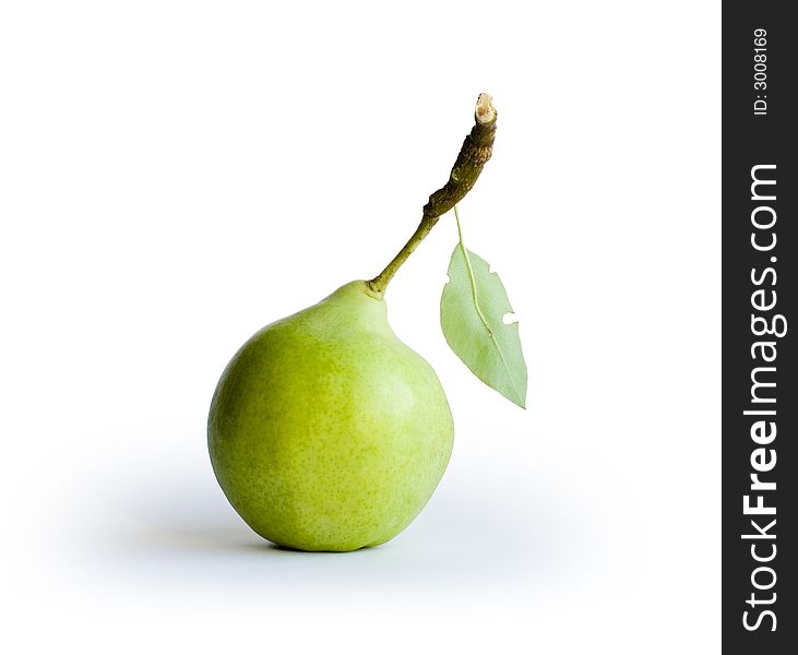 Green pear with leaf on white background