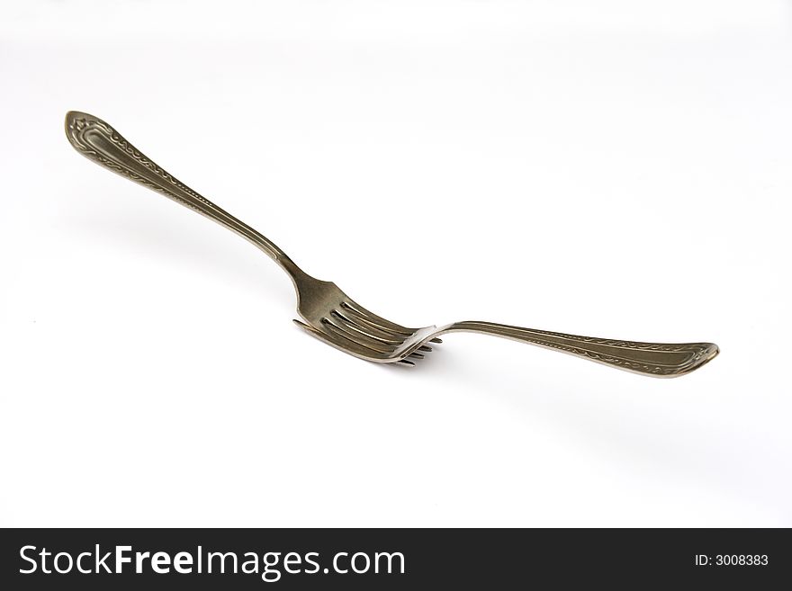 On a photo of a fork. A photon a white background.