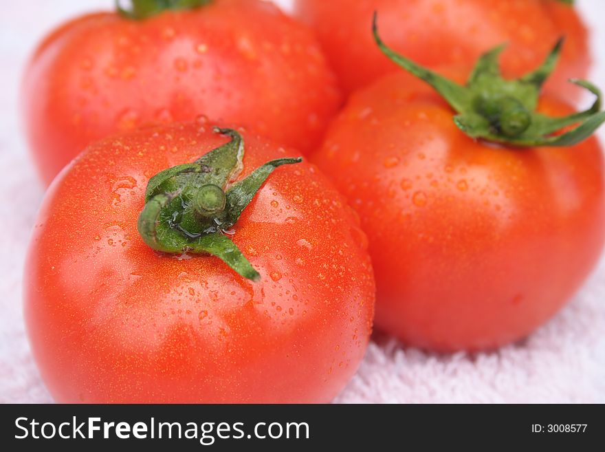 On a photo three red tomatoes. On a photo three red tomatoes.