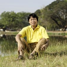 Asian Middle-aged Man In The Park Stock Image