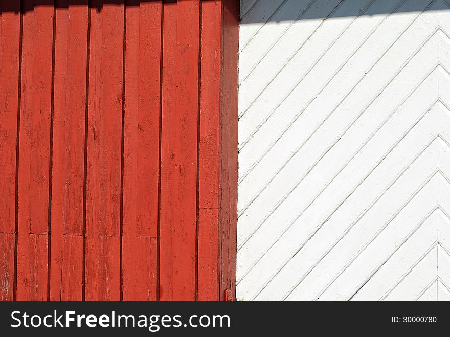 Old textured red and white painted wood pattern surface on a wall background. Old textured red and white painted wood pattern surface on a wall background