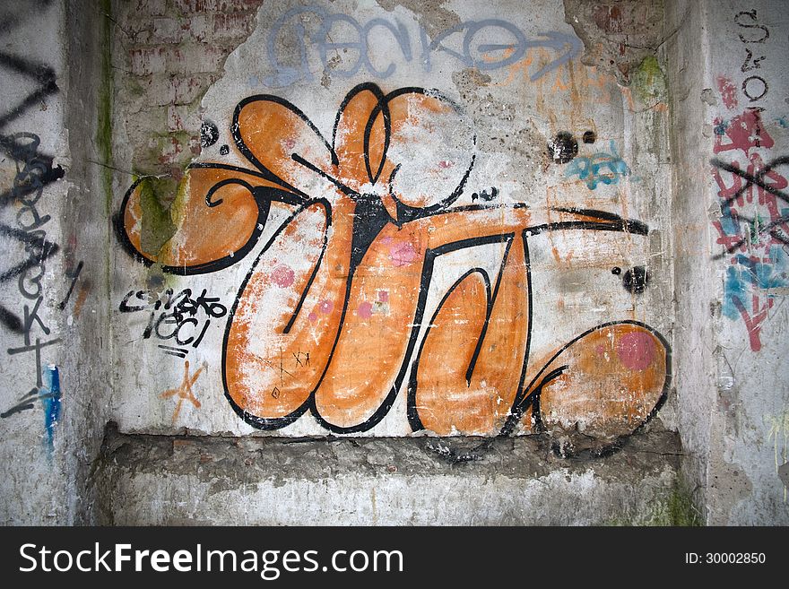 Graffiti painted on old cracked wall. Graffiti painted on old cracked wall