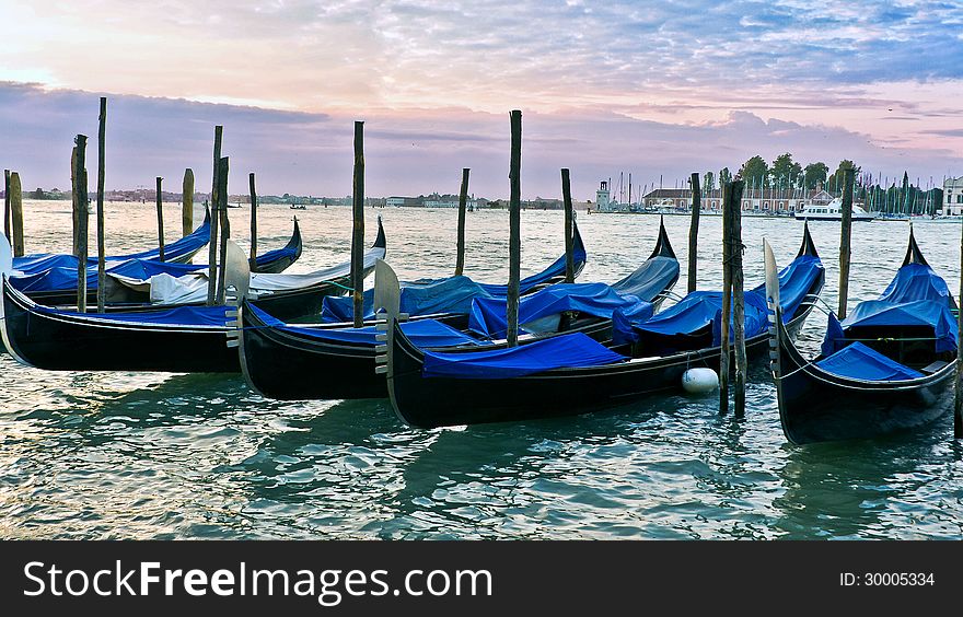 Gondolas on the Grand canal in Venice at Sunrise. Gondolas on the Grand canal in Venice at Sunrise
