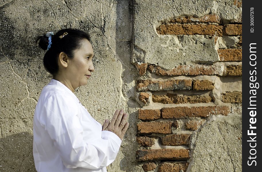 Thai woman in traditional style clothes with typical welcome expression. Thai woman in traditional style clothes with typical welcome expression