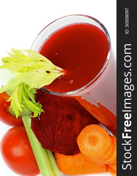 Vegetable Juice of Beet, Carrot, Celery and Tomatoes in High Glass closeup on white background