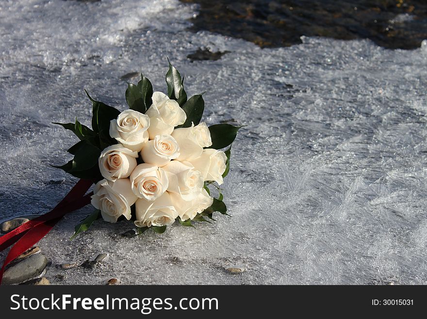 Bridal bouquet lying on the ice. Bridal bouquet lying on the ice.