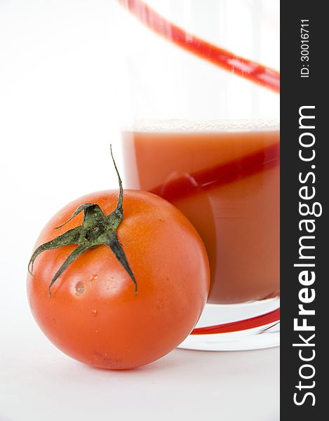 Fresh tomato with glass of tomato juice. Fresh tomato with glass of tomato juice
