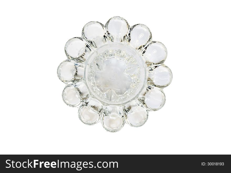 Empty glass candlestick isolated over white top view