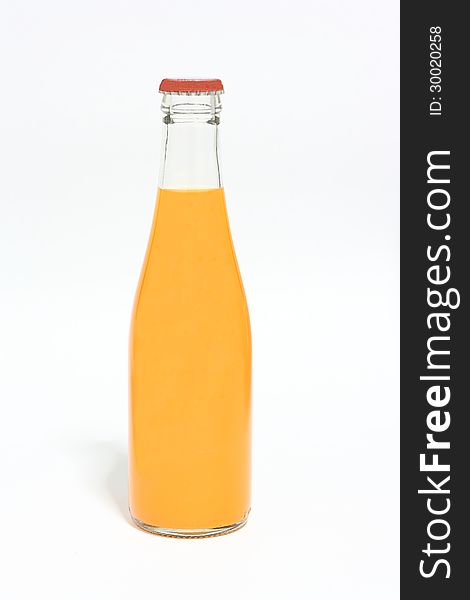 Orange juice in glass bottle