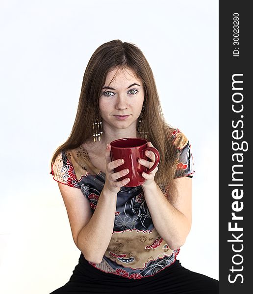 Young Woman with Beautiful Green Eyes with Red Coffee Cup