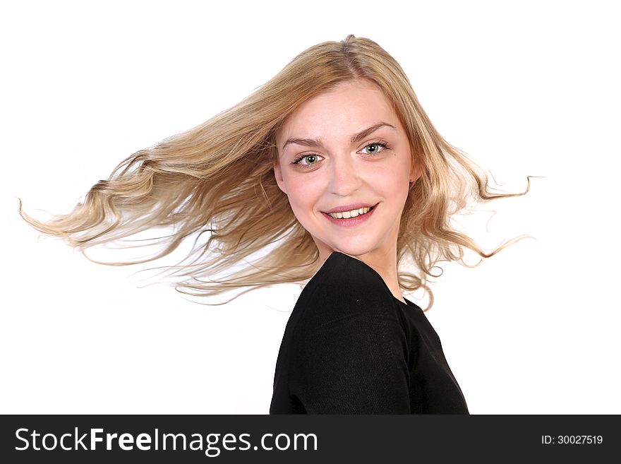 Portrait of a beautiful blonde with flying hair. lsolated on white background. Portrait of a beautiful blonde with flying hair. lsolated on white background