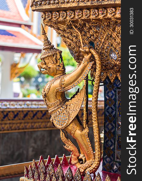 Garuda and Nagas, at the outside of the ubosot of Wat Phra Kaeo in Bangkok, Thailand. Temple of the Emerald Buddha.