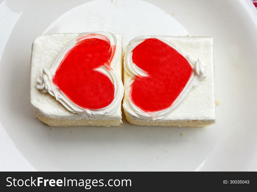 Beautiful cake red heart white background. Beautiful cake red heart white background