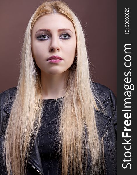 Close up portrait of a caucasian girl wearing a leather jacket