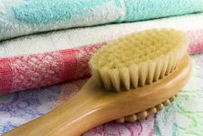 Wooden Brush With The Handle For Massage Of A Body And A Towel. Royalty Free Stock Photos