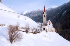 A Wintertime View Of A Small Church With A Tall Steeple Royalty Free Stock Photos