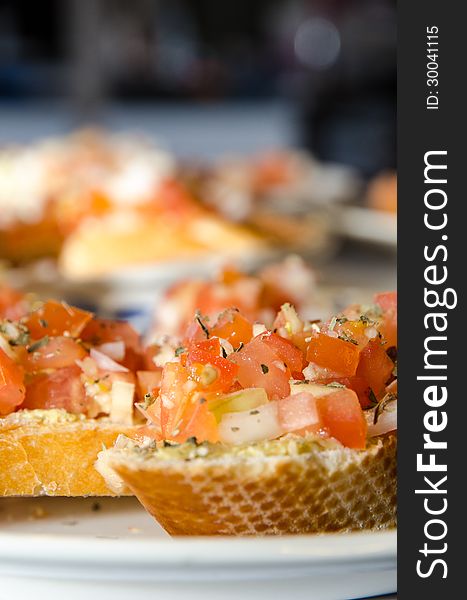 Italian bruschetta with slices fresh tomato and onion