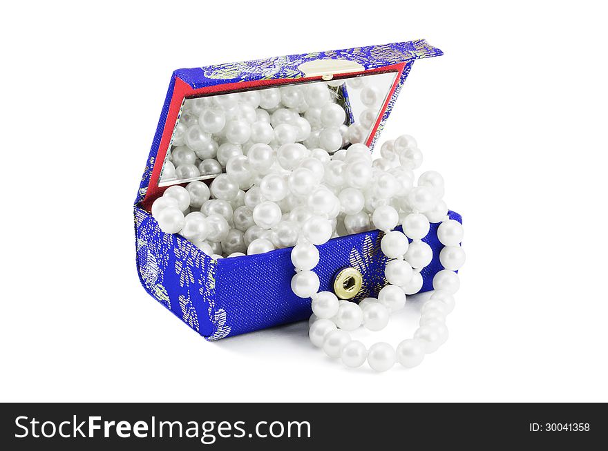 Small Casket with a necklace from pearls on a white background. Small Casket with a necklace from pearls on a white background