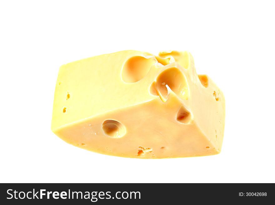 Swiss cheese piece isolated on white background