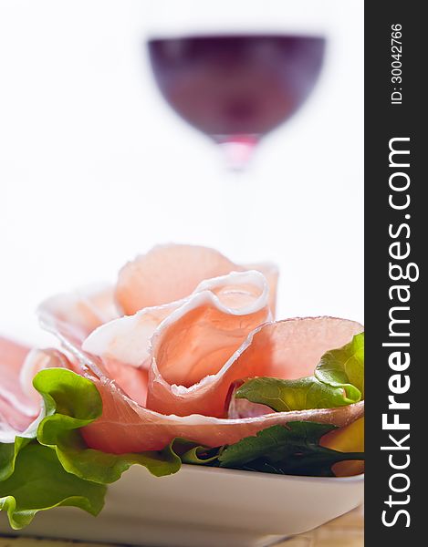 Glass With Red Wine And Ham