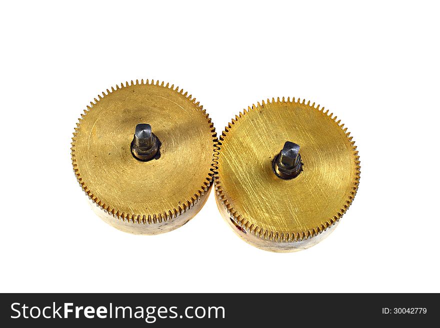 Two massive brass pinions in interlocking isolated on white background. Two massive brass pinions in interlocking isolated on white background