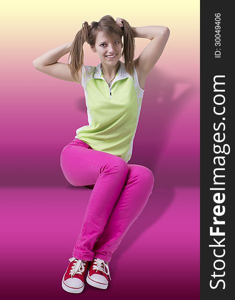 Fashionable teenager girl in sitting pose, having fun. On lightened up pink background. Fashionable teenager girl in sitting pose, having fun. On lightened up pink background.