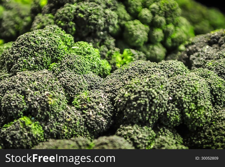 Green Broccoli in a pile on a farm stand