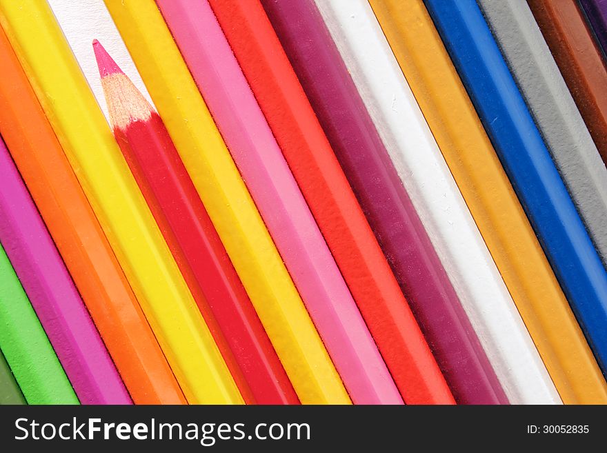 Set of color pencils against a white background. Suitable for an abstract background. Set of color pencils against a white background. Suitable for an abstract background.