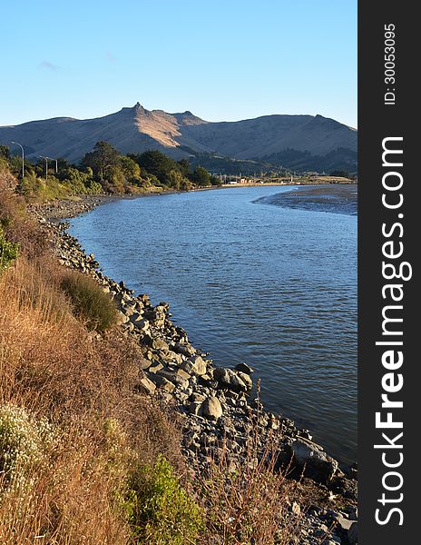 Heathcote River and Port Hills at Sunset, Christchurch, New Zealand. Heathcote River and Port Hills at Sunset, Christchurch, New Zealand