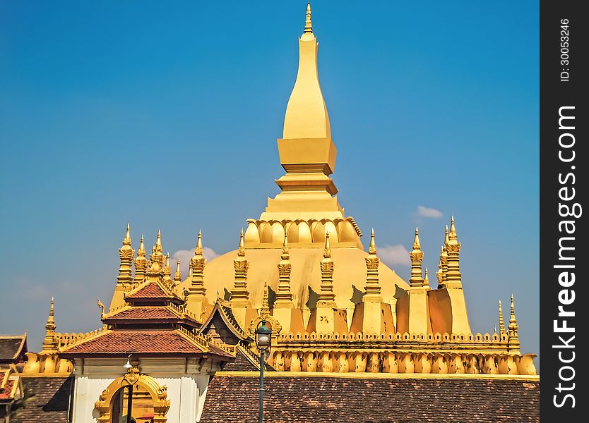 Lao golden stupa with blue sky background