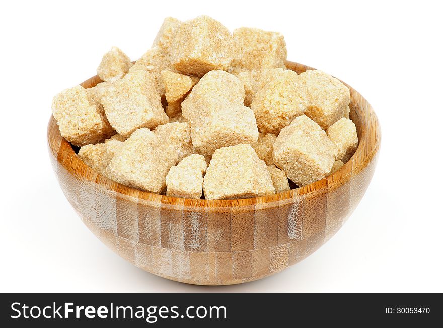 Wood Bowl with Cubes of Brown Cane-Sugar in on white background. Wood Bowl with Cubes of Brown Cane-Sugar in on white background