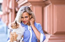 Woman With Chihuahua In Old City Royalty Free Stock Image